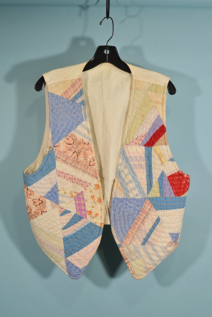 antique quilt vest on hanger